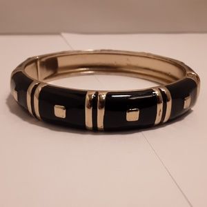 Black enameled bracelet with siver colored accents